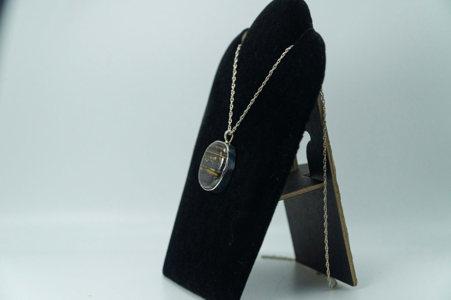 Tiger Iron Set In .925 Silver Pendant