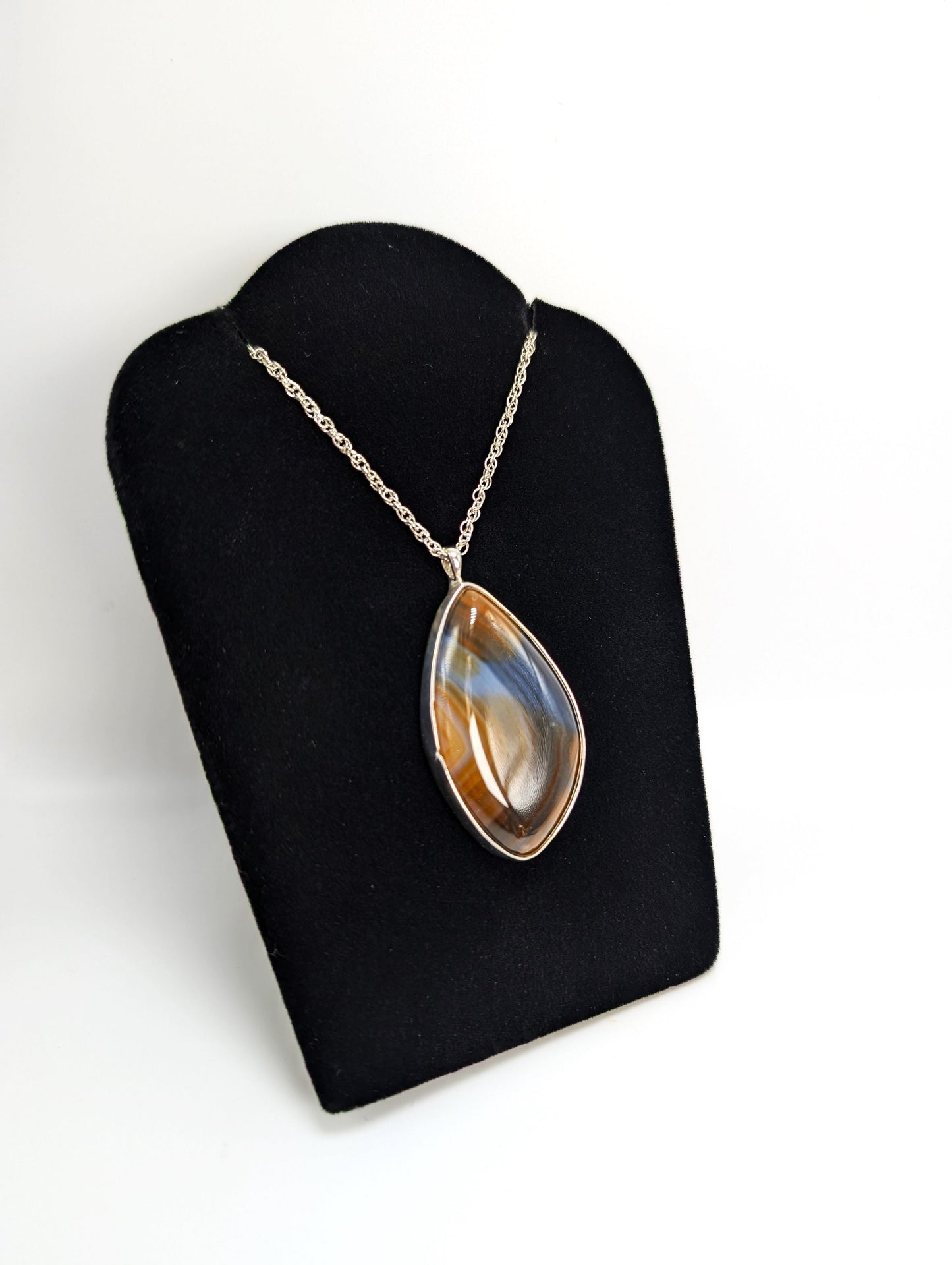 Banded Agate Set In Silver Pendant